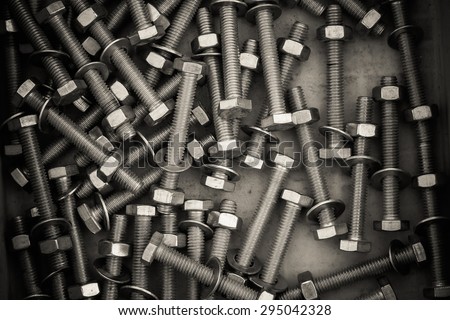 Nuts and bolts taken as background in top view, vintage style
