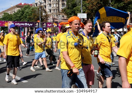 KIEV, UKRAINE - JUNE 11: Swedish football fans walking arond in Fan-Zone of UEFA Euro 2012 on June 11 2012 in Kiev UKRAINE. The slogan of EURO 2012 Football Championship is \