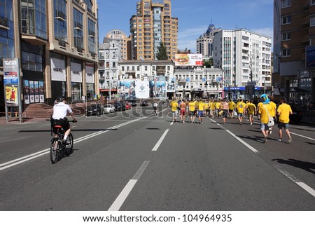 KIEV, UKRAINE - JUNE 11: Swedish football fans walking arond the city during Euro 2012 on June 11, 2012, in Kiev, UKRAINE. The slogan of EURO 2012 Football Championship is \