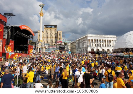KIEV, UKRAINE - JUNE 15: Crowd of fans from different countries on Fan Zone of Euro 2012 on June 15, 2012 in Kiev, Ukraine. The Ukrainian host cities are Lviv, Donetsk, Kharkiv and Kiev.