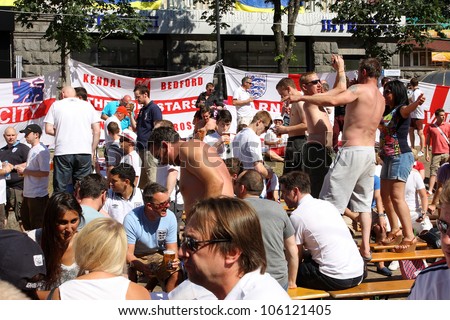 KIEV, UKRAINE - JUNE 24: Crowd of English people in Fan-Zone of Euro 2012 on June 24, 2012 in Kiev, Ukraine. The Ukrainian host cities are Lviv, Donetsk, Kharkiv and Kiev.