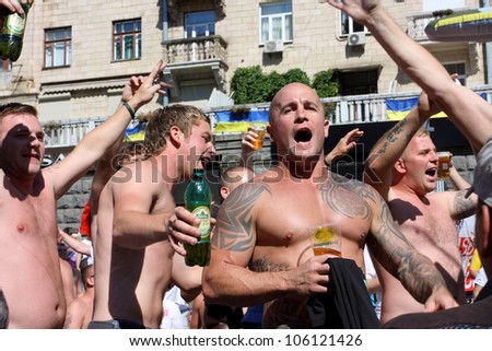 KIEV, UKRAINE - JUNE 24: Strong English football fans sing the song in Fan-Zone of Euro 2012 on June 24, 2012 in Kiev, Ukraine. The Ukrainian host cities are Lviv, Donetsk, Kharkiv and Kiev.