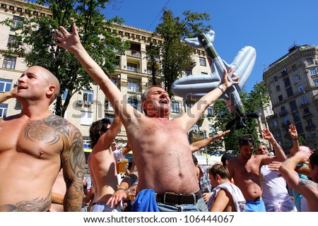 KIEV, UKRAINE - JUNE 24: Happy crowd of football fans go crazy in Fan-Zone of Euro 2012 on June 24, 2012 in Kiev, Ukraine. The slogan of EURO 2012 Football Championship is \