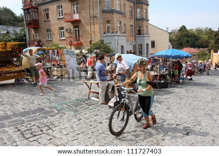 KIEV, UKRAINE - AUGUST 24: Ukrainian people and the tourists walking on the Andrew\'s descent at the time of celebration of the Independence Day of the country Ukraine on August 24 2012 in Kiev Ukraine