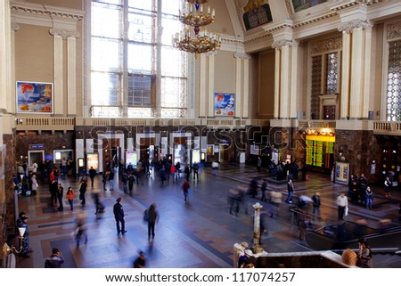 KIEV, UKRAINE - OCTOBER 27: Crowd of busy people inside the building of Central Railway Station on October 27, 2012 in Kiev, Ukraine. Kiev\'s Central Railway Station serving 170,000 passengers per day.