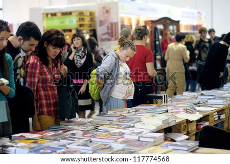 KIEV, UKRAINE - OCT 7: Visitors choose books at the 2-nd International Festival BOOK ARSENAL on October 7, 2012 in Kiev, Ukraine. The guests of the fair were Alessandro Baricco & Josef Winkler