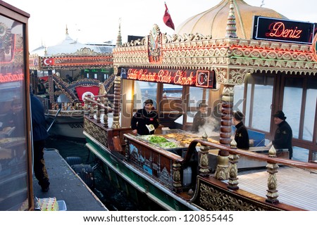 ISTANBUL, TURKEY -  JAN 28: Popular turkish buffet on the Golden Horn with fish sandwiches on sale at January 28, 2012 in Istanbul, Turkey. Bordered on 3 sides by seas, Turkey is a nation of water.