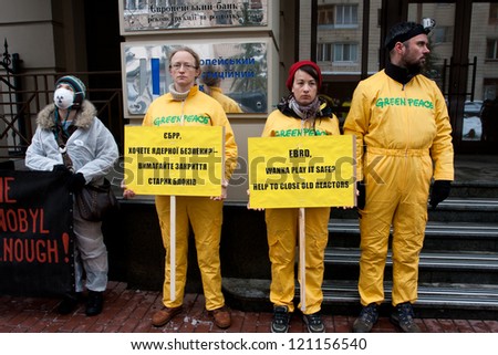 KIEV, UKRAINE - JAN 7: Greenpeace activists in radiation protection suits urges bank EBRD not to loan to Ukraine for building new nuclear reactors in Rivne & Khmelnytsky on January 7, 2012 in Kiev