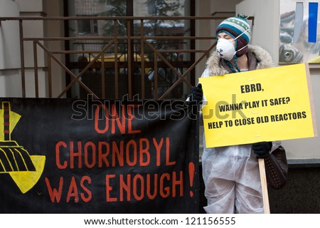 KIEV, UKRAINE - JAN 7: Greenpeace activist in radiation protection suits urges bank EBRD not to loan to Ukraine for building new nuclear reactors in Rivne & Khmelnytsky on January 7, 2012 in Kiev