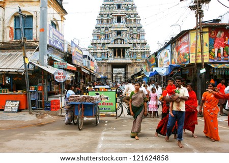 TIRUCHIRAPPALLI, INDIA - JAN 18: Hindu families returning from ancient Ranganathaswamy Temple on 18 January 2011 in Tiruchirappalli India. The temple area is 6,31,000 sq m. The largest temple in India