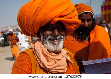 ALLAHABAD, INDIA - JAN 29: Elderly indian pilgrim in orange turban on the celebration holy Kumbh Mela, on January 29, 2013 in Allahabad, India. Festival Kumbh Mela 2013 will take 130 000000 visitors