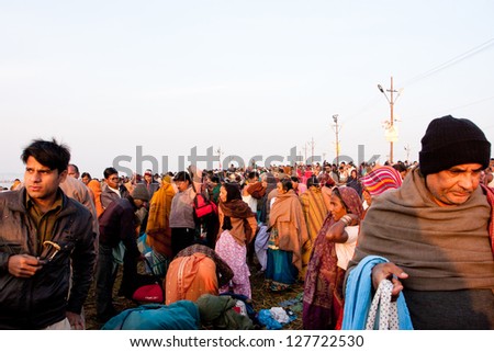 SANGAM, INDIA - JAN 27: People movement at time of celebration of Paush Purnima during the biggest hindu festival Kumbh Mela on January 27, 2013 in Allahabad, India. In 2013, Mela take 130 mill.people