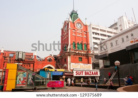 KOLKATA, INDIA - JAN 21: People walking around historical building New Market of Lindsay street on January 14, 2013 in Kolkata, India. New Market was open with fanfare to the English populace in 1874