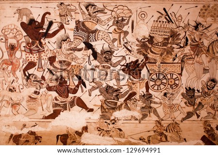 ORCHHA, INDIA - DEC 21:Demons and devils are fighting with the gods on the mural at Lakshmi Narayana Temple on on December 21, 2012, in Orchha, India. The temple was built by King Veer Singh in 1622