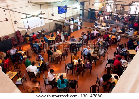 KOLKATA, INDIA - JAN 18: Visitors of popular Indian Coffee House have lunch on January 18 2012 in Kolkata India. The India Coffee House chain was started by the Coffee Cess Committee in 1936 in Bombay