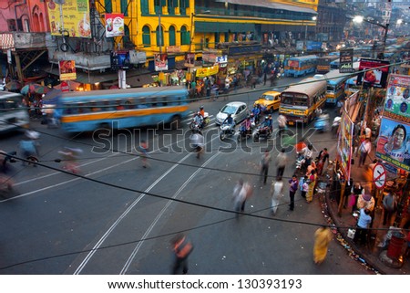 KOLKATA, INDIA - JAN 17: Street traffic blurred in motion at evening on January 17, 2013 in Kolkata, India. Kolkata has a density of 814.80 vehicles per km road length