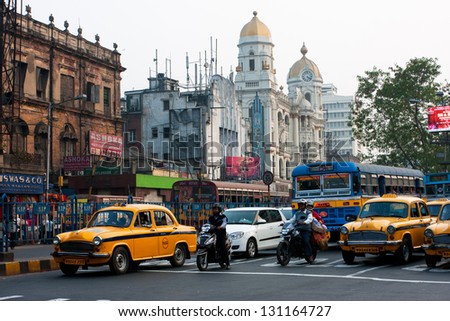 KOLKATA, INDIA - JAN 19: Motorbikes and the cars stopped on the road of old asian metropolis on January 19, 2013 in Kolkata, India. Kolkata has a density of 814.80 vehicles per km road length.