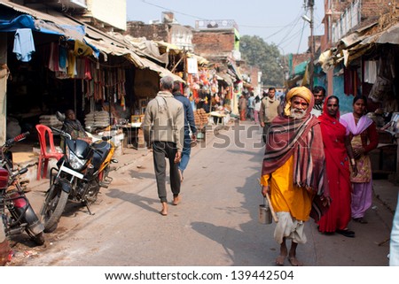 Chitrakoot, India - Dec 30: Poor People Walking On The Indian Street At The Beautiful Sunny Day On December 30, 2012 In Chitrakoot, India. Population Of Chitrakoot Is 22,294. Males Constitute 57%.