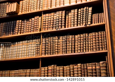 VIENNA - MAY 30: Large bookcase with the leather-bound books in the old Austrian National Library on 30 May, 2013 in Austria. The largest library in Austria with 7.4 million items in its collections.