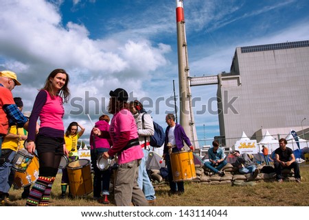 ZWENTENDORF, AUSTRIA - JUNE 1: People play music on the festival against the Zwentendorf Nuclear Power Plant on June 1, 2013 in Austria. The atomic plant was built in 1976 with a hot water reactor