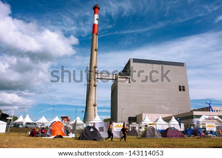 ZWENTENDORF, AUSTRIA - JUNE 1: Ecologycal Festival camp with the tents near the Zwentendorf Nuclear Power Plant on June 1, 2013 in Austria. The atomic plant was built in 1976 with a hot water reactor