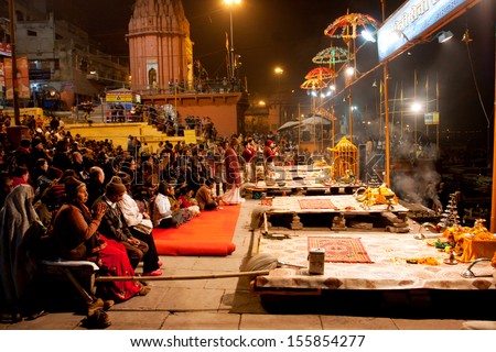 VARANASI, INDIA - JANUARY 3: People gather to watch night ritual \