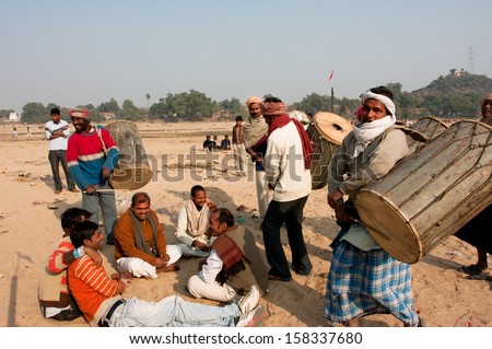 BIHAR, INDIA - JAN 9:  Band of the elderly drummers makes religious performance for the dead souls on Januari 9 2013 in Gaya, India. Bihar with total population 82 million people has 62,8% of literacy