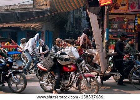 VARANASI INDIA JAN 4 Traffic jam on the street with a lot of motorcycles and bicycles on January 4 2013 in ancient indian city Varanasi Varanasi urban agglomeration has a population 1 5 million VARANASI INDIA JAN 4 Traffic jam on the street with a lot of motorcycles and bicycles on January 4 2013 in ancient indian city Varanasi Varanasi urban agglomeration has a population 1 5 million
