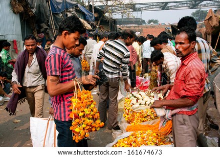 Kolkata, India - Jan 13: Customers Communicate With The Traders Of Crowded Flower Market On January 13, 2012 In Calcutta. Only 0.81% Of The Kolkata'S Workforce Employed In Primary Sector (Agriculture)