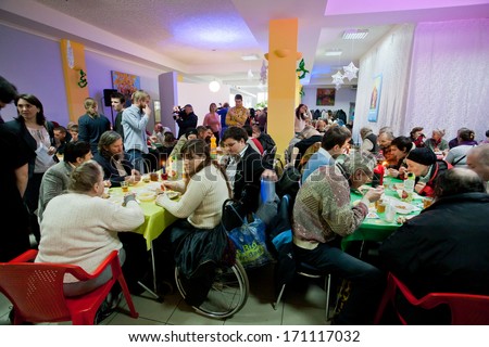 Kiev, Ukraine - Dec 10: Poor People Sit Around Tables With Food At The Christmas Charity Dinner For The Homeless On December 10, 2013, In Kyiv, Ukraine. About 100,000 Adults Are Homeless In Ukraine.