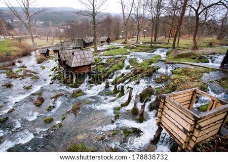 Wooden water mills stands on a fast flowing river in the famouse historical village near city Jajce in Bosnia and Herzegovina.