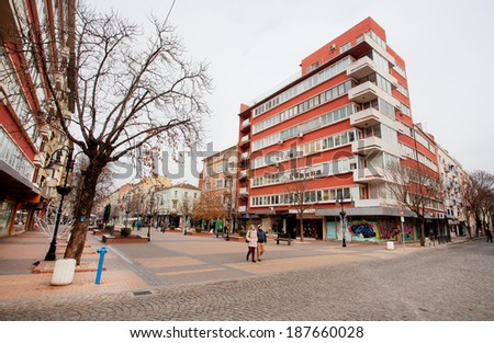SOFIA, BULGARIA - JANUARY 1: People walk through the street on modern city January 1, 2014. Sofia is the 15th largest city in the European Union with a population of around 1.3 million people.