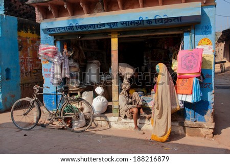 CHITRAKOOT, INDIA - DEC 28: Customers came to the small indian grocery store at morning on December 28, 2012 in Madhya Pradesh. Population of Chitrakoot is 22,294. By the legend, Lord Rama lived here