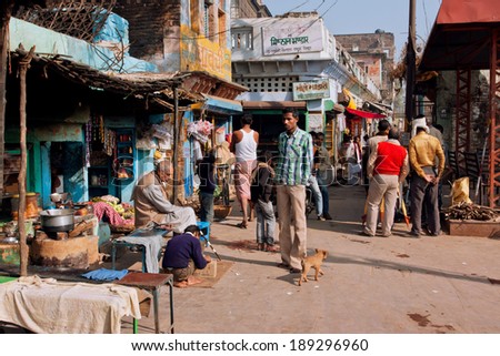 CHITRAKOOT, INDIA - DEC 29: People meet for talking on the crowded indian street near the outdoor cafe on December 29, 2012. Population of Chitrakoot is 22,294. By the legend, Lord Rama lived here