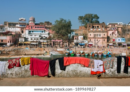 MADHYA PRADESH, INDIA - DEC 27: Laundered clothes and underwear drying on the fence in the beautiful indian town background on December 27 2012 in Chitracoot. Population of Chitrakoot is 22,294 people