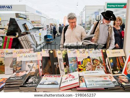 PRAGUE - MAY 16: Many people choose art and photo books at the indoor book market on May 16, 2014 in Czech Republic. Fourteenth-largest city in the European Union, Prague is home to 1.3 million people