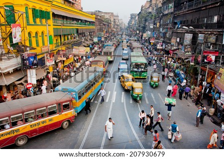 KOLKATA, INDIA - JAN 22: Traffic jam with hundreds of city taxi, buses and pedestrians of busy city road on January 22, 2013 in Calcutta. Kolkata has a density of 814.80 vehicles per km road length
