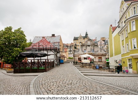 KLODZKO, POLAND - MAY 18: Cobble stones of the old street with tiny shops in center of the old town of Bohemia on 18 May, 2014. Klodzko city (with 28,250 inhabitants) is a part of Silesia since 1763