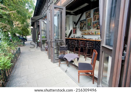 KRAKOW, POLAND - AUG 1: Open windows of modern bar in luxury restaurant of the city on August 1 2014. Krakow with popul. of 800,000 people has 2.35 mill. foreign tourists annually