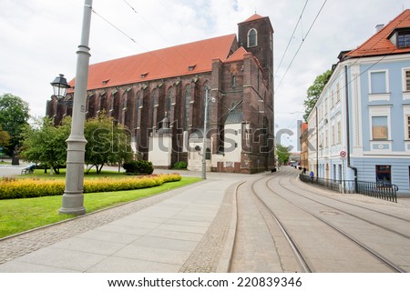 WROCLAW, POLAND - MAY 19: Colorful historical buildings over tram rails of old polish city on May 19, 2014. Population of Wroclaw is 633,000, and it is the 4th largest city in Poland