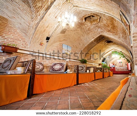 ZANJAN, IRAN - OCT 7: Interior of Persian restaurant inside the 400 years old caravanserai with the brick domes on October 7 2014. With a population of 400.000, Zanjan is the 20th largest city in Iran