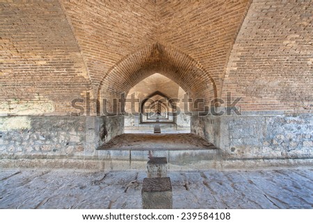 Corridor between the brick walls under the old bridge in Isfahan, Iran, Middle East