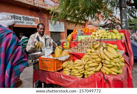 JAIPUR, INDIA - JAN 25: Banana, guava and other exotic fruits sold by the street seller in Pink City on January 25, 2015. Jaipur, with population 6,664000 people, is a capital of Rajasthan