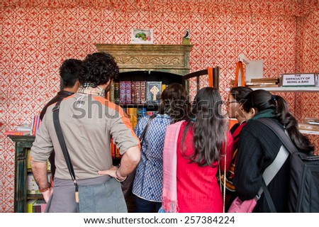 JAIPUR, INDIA - JAN 21: Students standing at open bookcase with rare editions of books during the Jaipur Literature Festival on January 21 2015. From 2006 the festival is world\'s largest literary fest