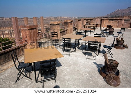 JODHPUR, INDIA - JAN 28: Tables of morning empty restaurant on the top of indian fortress on January 28, 2015. Jodhpur, with population 1,290,000 people, is a center of Marwar region of India