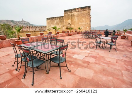 JAIPUR, INDIA - JAN 23: Vintage furniture in rooftop cafe under the Amber Fort on January 23, 2015. Jaipur, with population 6,664000 people, is capital of Rajasthan