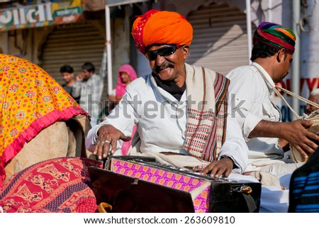 JAISALMER, INDIA - MAR 1: Music band of elderly Rajasthan musicians play songs for visitors of the Desert Festival on March 1, 2015 in India. Every winter Jaisalmer takes the famous Desert Festival