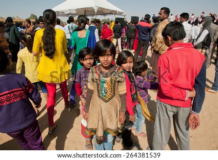 JAISALMER, INDIA - MAR 1: Unidentified children lost in the crowd of people during the popular annual Desert Festival on March 1, 2015. Every winter Jaisalmer takes the famous Desert Festival