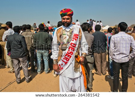 JAISALMER, INDIA - MAR 1: Last year winner of indian contest Mr. Desert posing on the famous annual Desert festival on March 1, 2015. Every winter Jaisalmer takes the Desert Festival