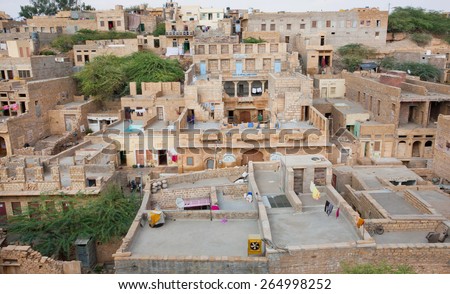 JAISALMER, INDIA - MAR 1: Cityscape with asian brick houses in historical area of indian city  on March 1, 2015. Jaisalmer lies in the heart of the Thar Desert and has a population of about 78,000.